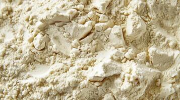This flour is agglutinated with rough co grains clumped together to form a dense and chunky texture photo