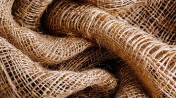 The intricately intertwined threads of burlap tightly packed together and creating a unique earthy texture photo