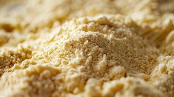 The flour appears to be golden in color with a finegrained texture that resembles soft sand photo