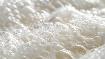A thick layer of tightly packed bubbles resembling a soft cloud with a subtle sheen and smooth texture photo