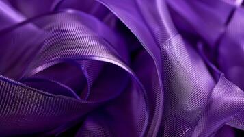 A macro image of a deep purple satin ribbon capturing the soft and supple texture of the fabric photo