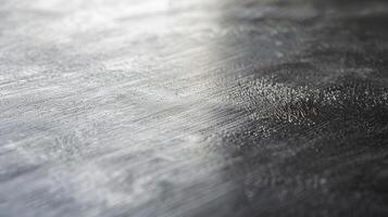 A clean and impeccable texture with a slight grainy appearance giving the polished aluminum a refined and industrial vibe photo