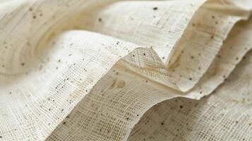 An embossed paper with a vintage feel showcasing a woven texture with distress marks and little speckles photo