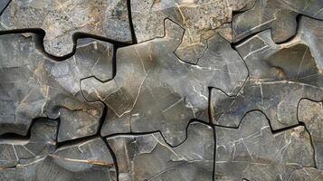 The co texture of chiseled stone resembling a jigsaw puzzle with its irregular shapes and pieces photo