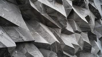The sharp angles and deep sharp grooves of chiseled stone giving it a dramatic and imposing presence photo