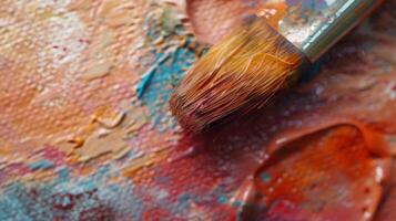 The fuzzy matted texture of a bristly brush after being used to blend wet watercolors with faint streaks and a soft uneven surface photo