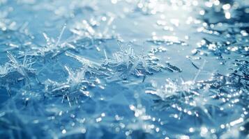 Delicate icy splinters jutting out from the surface reflecting the cool blue hues of the winter sky photo
