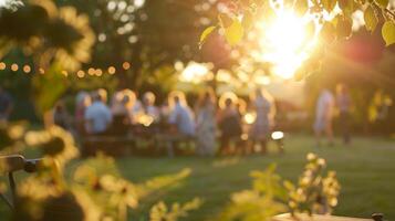 Slightly blurred images of guests enjoying a sundrenched garden part photo