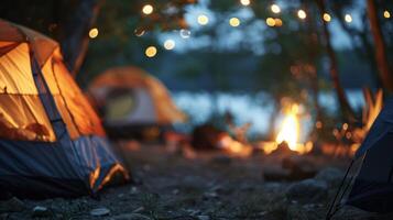 Blurred outlines of tents and a distant campfire adding to the serene atmosphere of a campsite photo