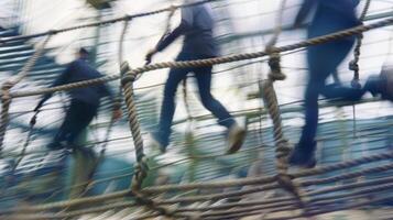 Hazy shot of colleagues navigating an obstacle course at the retreat photo