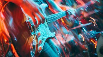 Blurred colors and shapes of hands strumming guitars and tapping drum photo