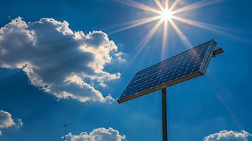 A closeup of a solar panel on a street light with the suns rays directly hitting the panel to generate energy photo
