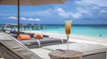 An exclusive beach club where guests can enjoy a private beach butler service delivering cocktails right to their lounger photo
