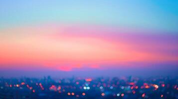 A soft focus on the twilight sky cityscape lights in the distance creating a dreamy spectrum of colors that eases the transition from day to night. photo