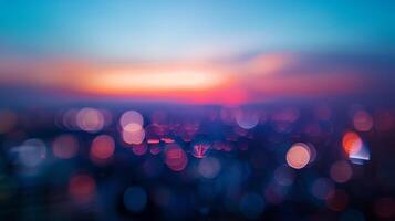 Defocused The bustling city lights blur and smear together creating an otherworldly distortion as the last rays of daylight vanish into the dusk sky. photo