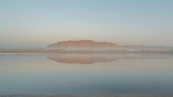Hazy desert horizon engulfs Mirage Mirrors causing a beautiful mirage of endless reflective illusions across the shifting dunes. photo
