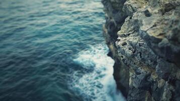 Softly blurred panoramic view of rugged cliffs and boundless ocean mirroring the sense of adventure and freedom that comes with exploring new horizons. photo