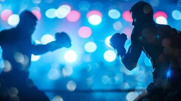 Defocused silhouettes of boxers their intense expressions and flying sweat frozen in time against a blurry backdrop of bright stadium lights. photo