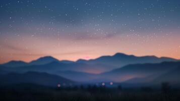 Defocused In the background a mountain range fades into a blur as the first stars begin to peek through the dimming evening sky enveloping the scene in a peaceful aura of twilight photo