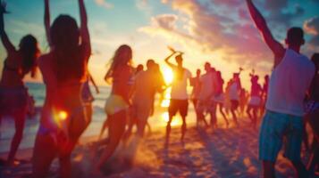 Defocused view of a beach party with groups of friends dancing and laughing together caught up in the victory vibes of the moment. photo