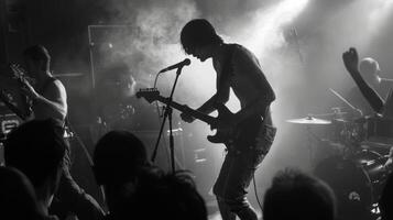 Raw passion fills the stage as a punk band thrashes through their set the frenzied crowd creating a hazy defocused background. photo