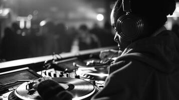 A viewer intently listening to the smooth beats of a DJs vinyl set during a battle photo