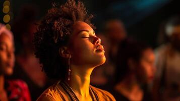 Eyes closed and heads swaying as attendees get lost in the music letting it take them on a journey photo