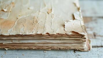 An old tattered notebook with worn out pages now reborn as a new recycled paper notebook with fresh pages ready to be filled photo