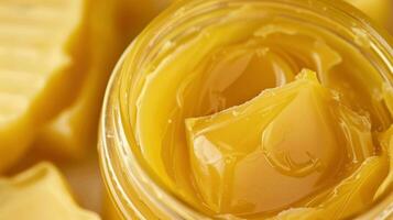 A jar of natural beeswax for creating encaustic paintings photo