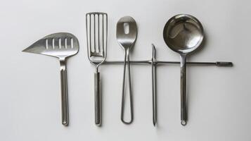 A set of stainless steel honey harvesting tools designed to be longlasting and environmentally friendl photo