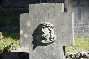 Vilnius, Lithuania - September 7th 2023 - Grave with face of Jesus at Rasos Cemetery photo