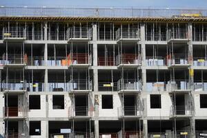 Warsaw, Poland, May 3rd 2024 - Building under construction with scaffolding photo