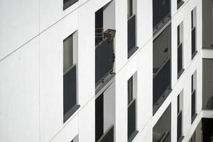 Warsaw, Poland, May 3rd 2024 - Modern residential building with balconies - close-up. Real estate and housing issues concept. photo