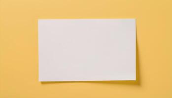 blank paper note on yellow background photo