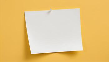 blank paper on yellow background photo