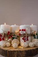 Four Advent candles calendar with Christmas zero waste decorations. Holiday preparation copy space for text. Catholic traditions of Christmas countdown new year winter holidays photo