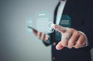 Check electronic documents on digital documents and checklist approval, Businessman checks transaction documents or electronic contract documents, Prepare check and approve concept. photo