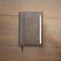 Notebook and pencil on a beautiful background in a large photo studio