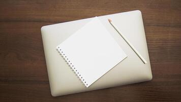 Notebook and pencil on a beautiful background in a large photo studio