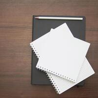 Notebook and pencil on a beautiful background in a large photo studio