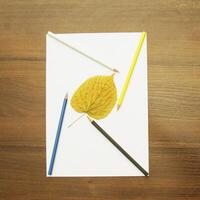 Notebook and pencil on a beautiful background in a large photo studio