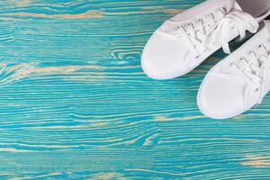White sneakers on color background. copy space. photo
