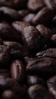 Closeup of roasted cocoa beans seeds texture background, roasting cocoa beans seed, macro cocoa, brown cocoa chocolate nibs video