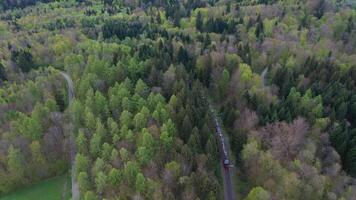 Train Going on Uetliberg Mountain. Zurich Skyline on Cloudy Day. Switzerland. Aerial View. Tilt Up video