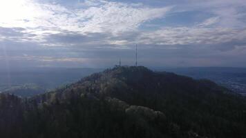 Uetliberg Mountain and Radio Tower on Cloudy Day. Switzerland. Aerial View. Drone Moves Forward video