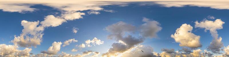 Dark blue sunset sky panorama with Cumulus clouds. Seamless hdr pano in spherical equirectangular format. Complete zenith for 3D visualization, game and sky replacement for aerial drone 360 panoramas. photo