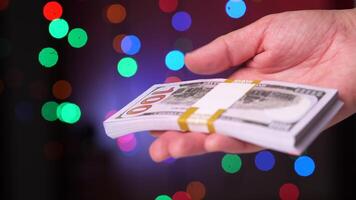 close-up view from different sides of a pack of dollars in a bank package video