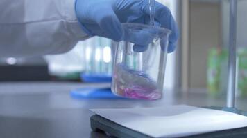close-up process of analyzing the quality of water, liquid in a laboratory video