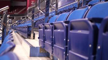 close-up of empty blue seats at the ice arena. folded chairs, seats video