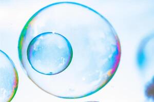 soap bubbles against the sky, reflection of the sun in the bubbles, color play, abstraction photo